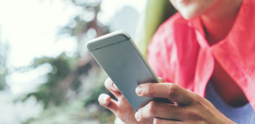 young woman looking into phone